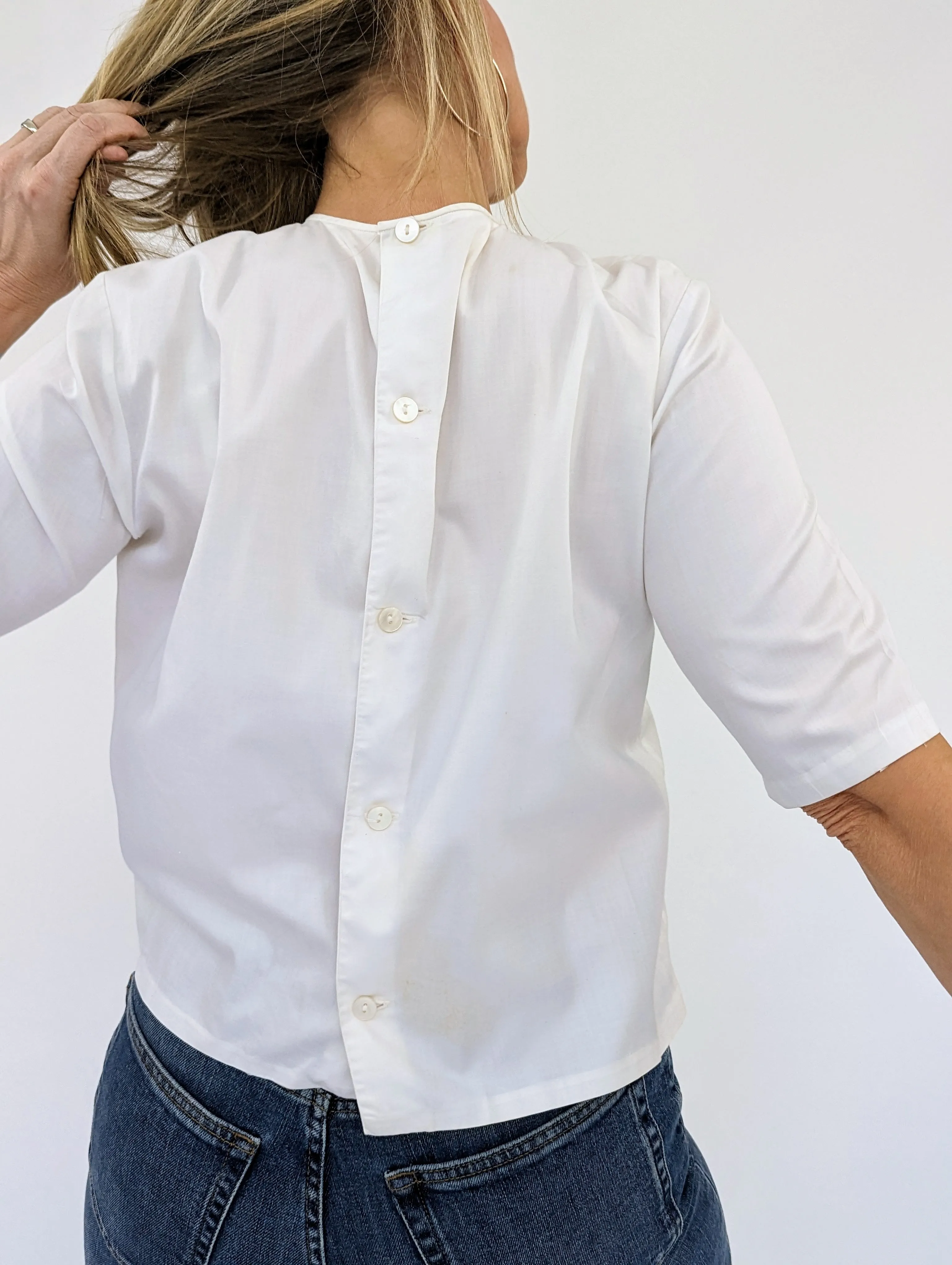 White lace fronted blouse with button back
